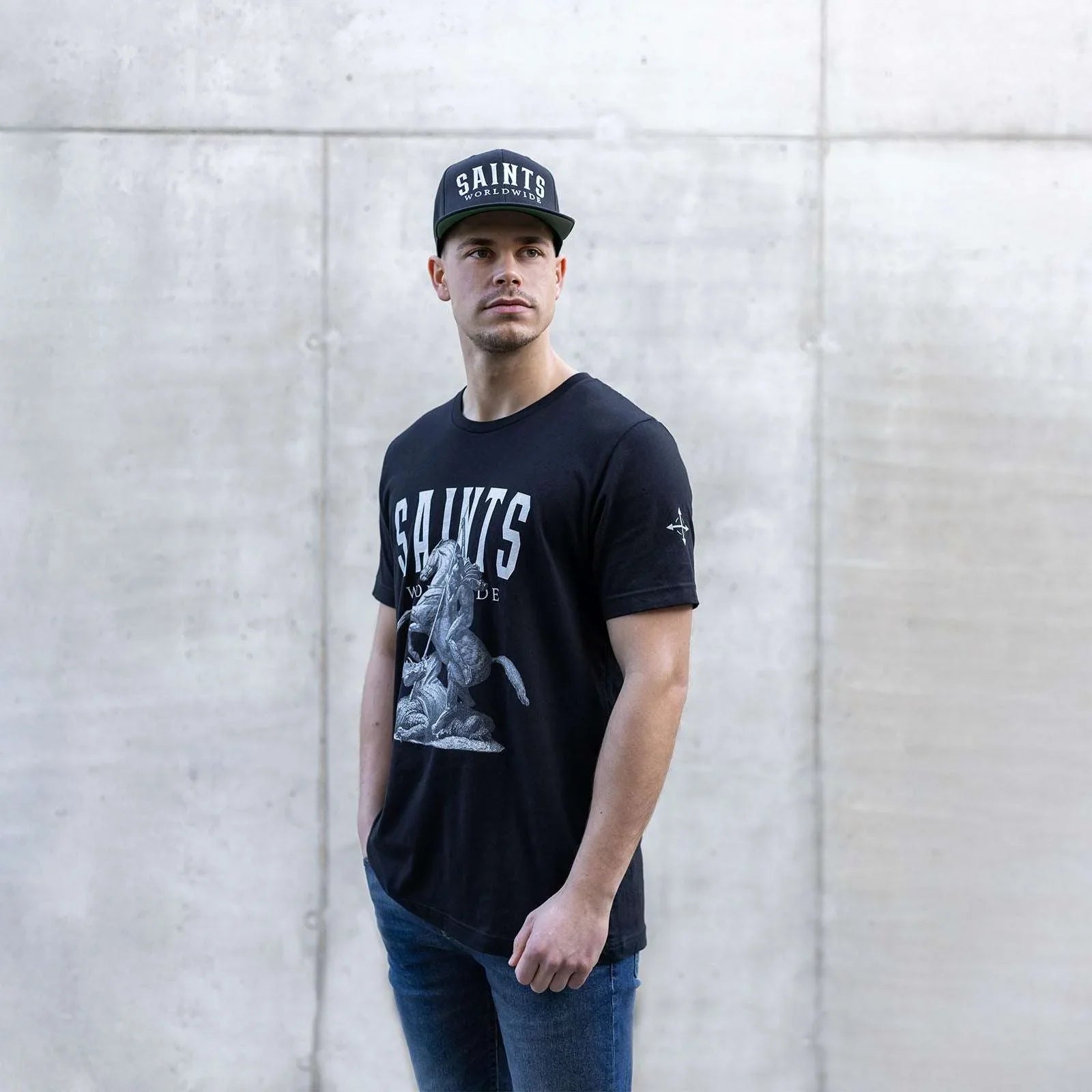 Model wearing SAINTS WORLDWIDE black Christian t-shirt