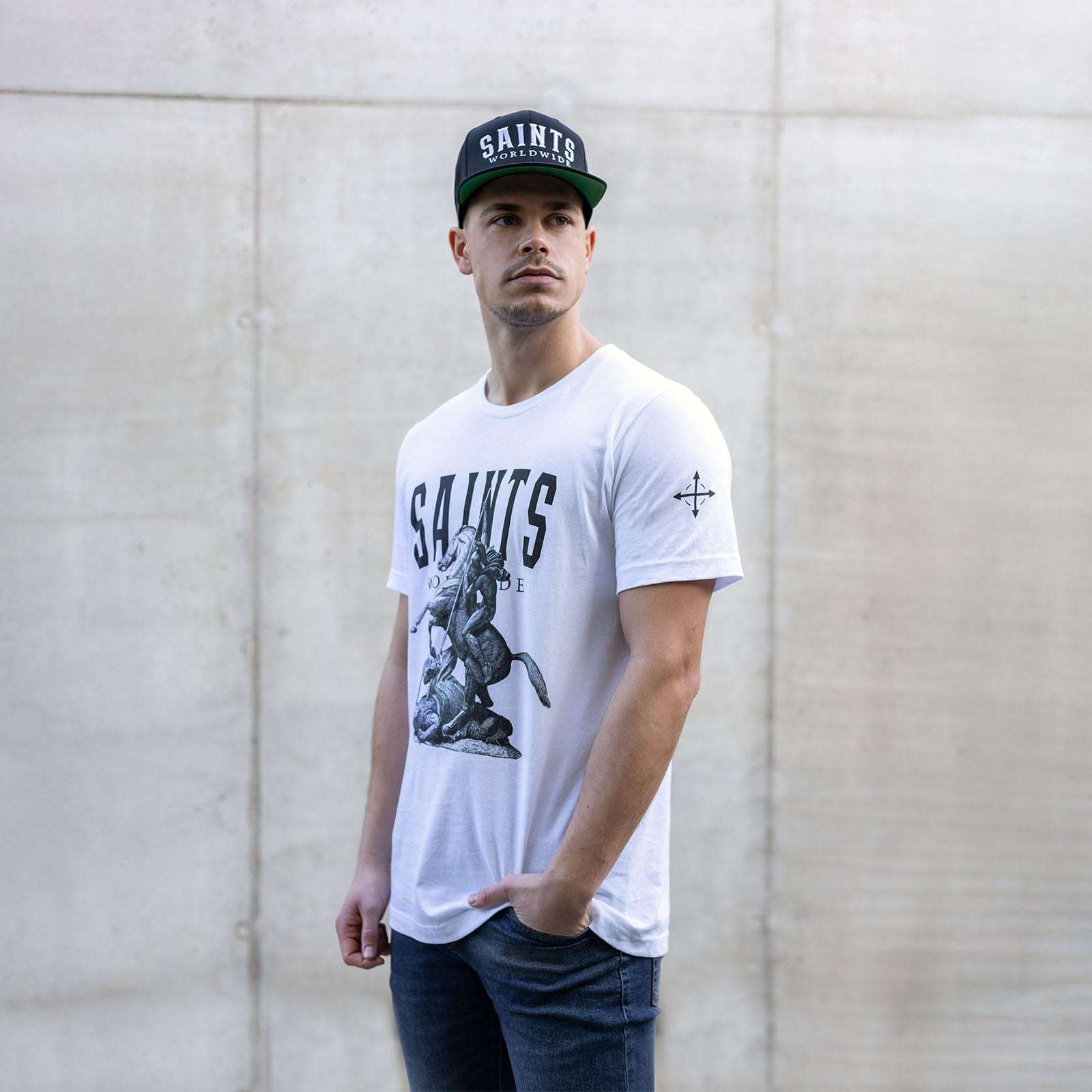 Man wearing Saints Worldwide white Christian t-shirt, front view
